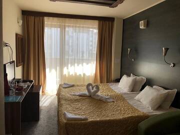 Фото номера Двухместный номер с 2 отдельными кроватями Отель Flora Hotel г. Боровец 20